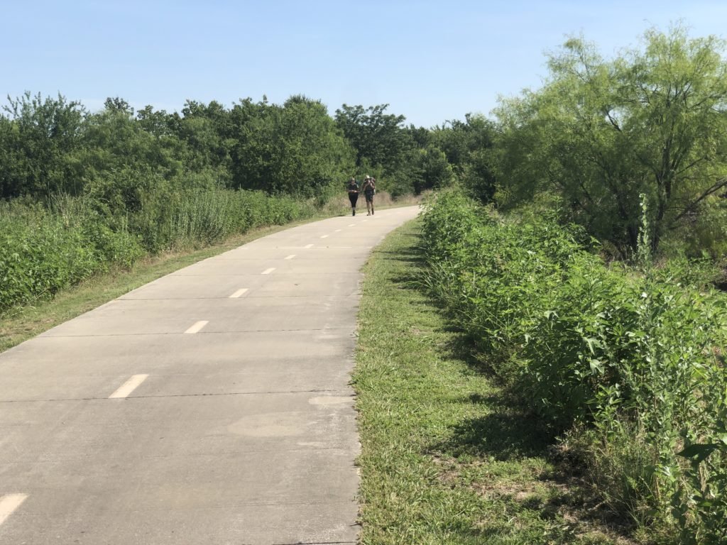 River Legacy: Joggers on the concrete path