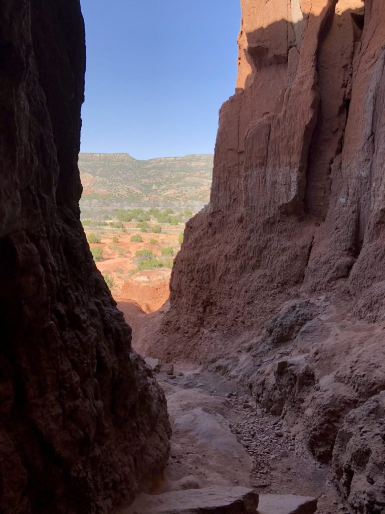Looking out of a cave at at Palo Duro Canyon State Park