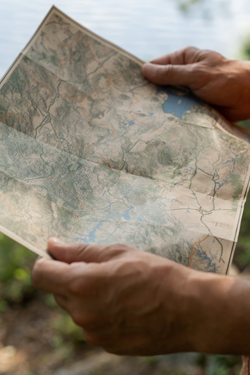 hands holding map